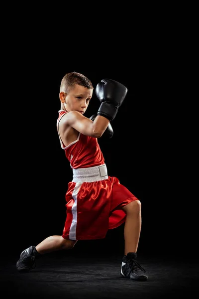 Young Beginner Boxer Sportive Boy Training Isolated Dark Background Concept — Zdjęcie stockowe