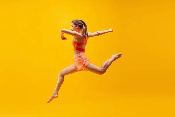 Running Jumping Full Length Portrait Young Sportive Girl Motion Isolated — Stok fotoğraf