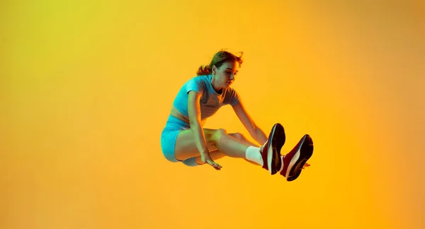 Flying Professional Longjumper One Female Athlete Sports Uniform Jumping Isolated — Stok fotoğraf