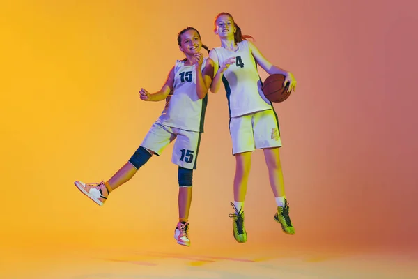 Jumping Happy Girls Basketball Players Action Isolated Neoned Background Concept — Foto Stock
