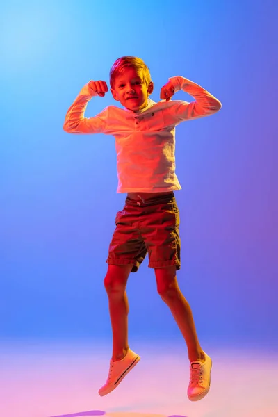 Jumping Studio Shot Stylish Little Boy Kid Posing Isolated Gradient — Φωτογραφία Αρχείου