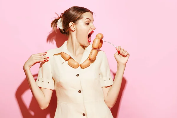 Young Woman Emotionally Eating Sausage Her Necklace Creative Food Advertisement — Stockfoto