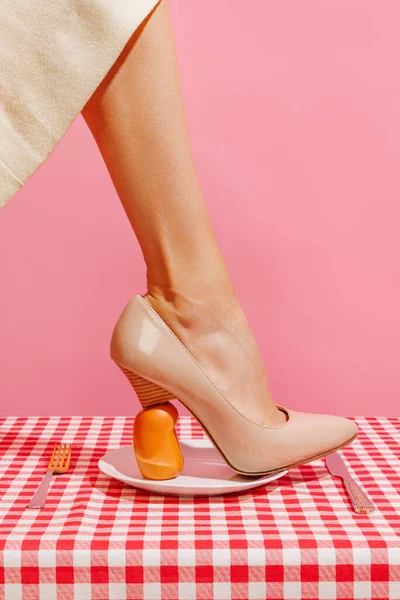 Food Pop Art Photography Cropped Image Female Leg Stepping Sausage —  Fotos de Stock