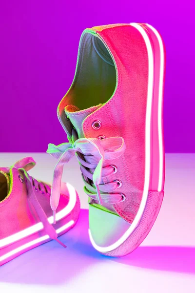 Image Fashionable Sports Shoes Sneakers Isolated Colored Neon Background Urban — Stock fotografie
