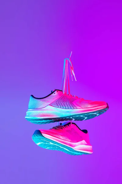 Image Fashionable Sports Shoes Sneakers Isolated Colored Neon Background Urban — Φωτογραφία Αρχείου