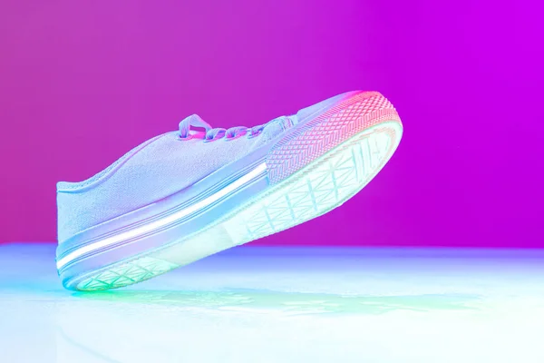 Female White Sports Shoe Sneakers Isolated Purple Neon Background Urban — Φωτογραφία Αρχείου