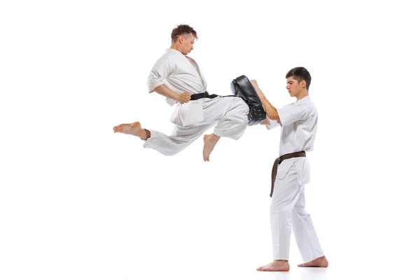 Shotokan Karate Two Athletes Karate Fighters Doboks Practicing Karate Isolated — Stockfoto