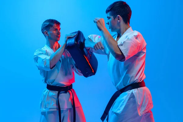 Studio Shot Sports Training Two Karatedo Fighters Doboks Isolated Blue — 스톡 사진