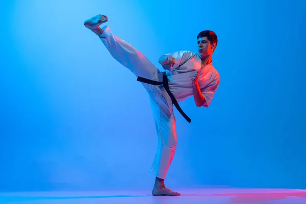Right Leg Punch One Young Man Karate Fighter White Kimono — Fotografia de Stock