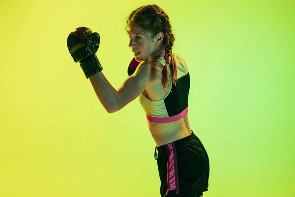 Dynamic Portrait Athletic Girl Mma Fighter Training Isolated Gradient Yellow — Fotografia de Stock