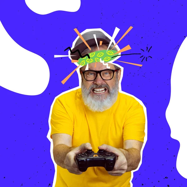 Gamer. Angry senior man playing computer game over bright blue background. Collage in magazine style. Surrealism, art, creativity, retro style concept. Old men like young people in modern life