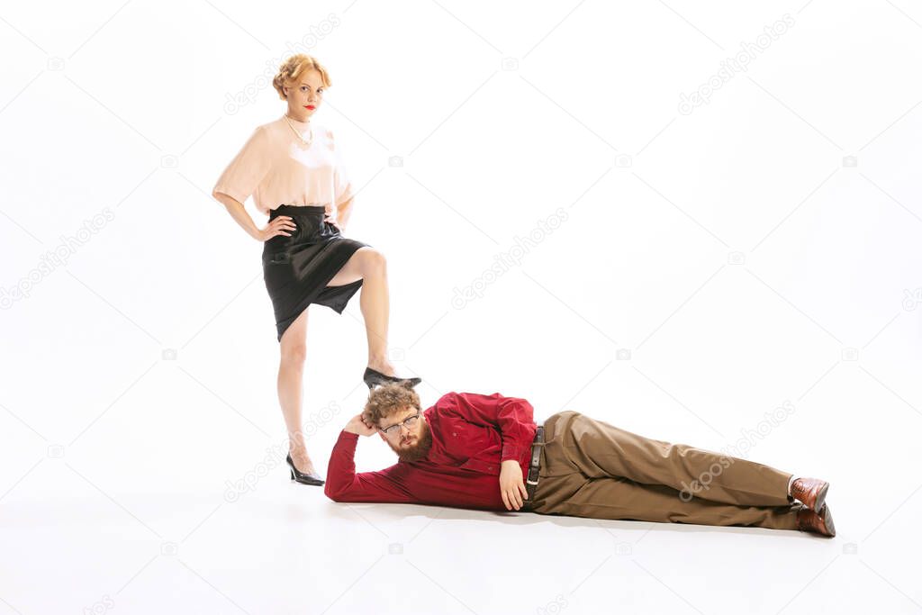 Henpecked. Family couple in vintage outfits sort things out isolated on white background. Concept of relationship, family, feminism, psychology of personality.