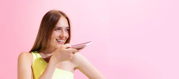 Smiling Young Charming Girl Student Using Phone Isolated Pink Background — 图库照片