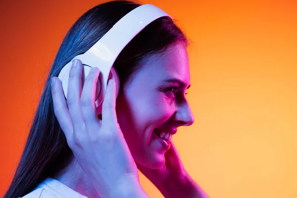 Lovely Sounds Closeup Young Girl Student White Headphones Isolated Orange — Zdjęcie stockowe