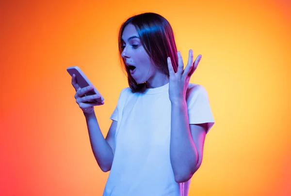 One Astonished Glad Woman White Shirt Looking Screen Smart Phone — Fotografie, imagine de stoc