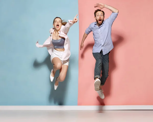 Unbridled Joy Astonished Man Woman Running Jumping Isolated Blue Pink — Stockfoto