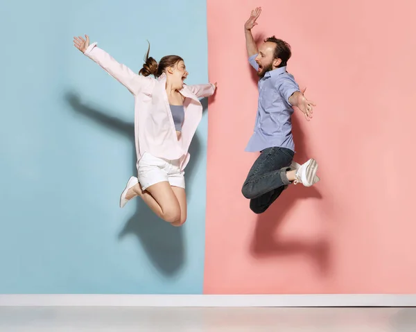 Unbridled Joy Astonished Man Woman Running Jumping Isolated Blue Pink — Stok fotoğraf