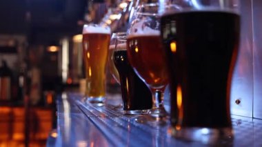 Beer pub party. Beer glasses with frothy light, ale, dark and craft beer. Alcohol concept. Vintage style. Beer craft. Bar table. Oktoberfest, party, drinks, taste concept