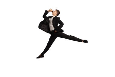 Brunch. Creative portrait of young office worker in business suit in action isolated over white background. Finance, aspiration, business, job concept. copyspace for ad