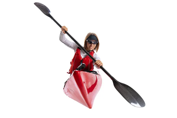 water sport activities. Young woman, sportsman in red canoe, kayak with a life vest and a paddle isolated on white background. Concept of sport, nature, travel, active lifestyle