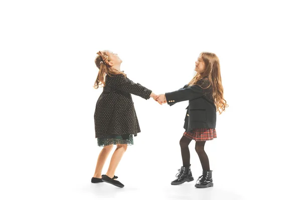 Portrait Two Little Beautiful Girls Stylish Dresses Playing Together Having — ストック写真