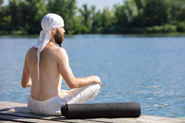 Doing Yoga Exercises Poses One Young Bearded Man Meditating Yoga — Fotografia de Stock