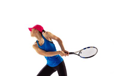 Energy and power. Young sportive woman, tennis player playing tennis isolated on white background. Healthy lifestyle, fitness, sport, exercise concept. Female athlete in motion, action or movement