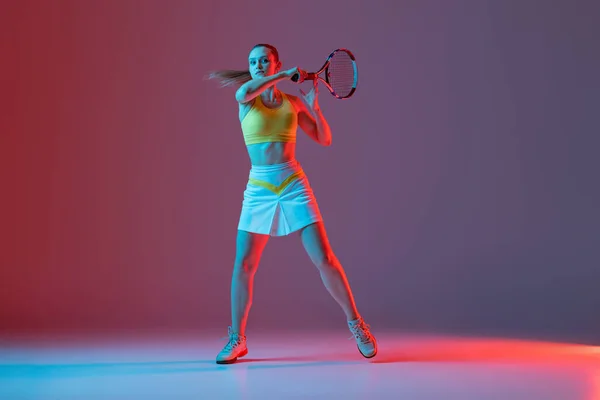 Young Woman Professional Tennis Player Training Isolated Blue Background Neon — Zdjęcie stockowe