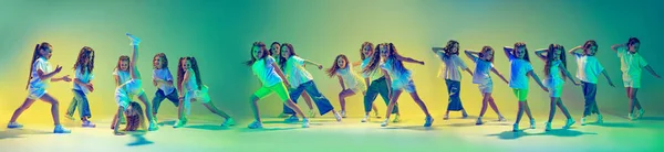 Flyer. Happy children dancing. Group of children, little girls in casual style clothes dancing in choreography class isolated on green background in yellow neon light. Concept of music, fashion, art
