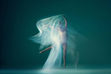 Light weightless gait of ballerina similar to smooth movement of cloud isolated over cyan color background. Art, beauty, aspiration, flexibility, inspiration concept. Blurring effect, mixed light