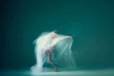 Light weightless gait of ballerina similar to smooth movement of cloud isolated over cyan color background. Art, beauty, aspiration, flexibility, inspiration concept. Blurring effect, mixed light