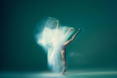 Light weightless gait of ballerina similar to smooth movement of cloud isolated over cyan color background. Art, beauty, aspiration, flexibility, inspiration concept. Blurring effect, mixed light