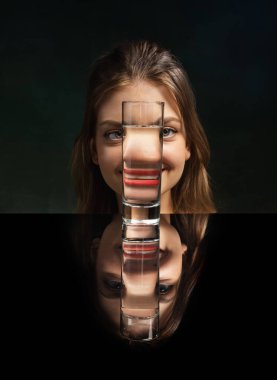 Grimace. Weird emotions, facial expression concept. Modern art photography. Funny weird girls face through glass of water. Object distortion, optical illusion. Minimalistic contemporary art. Poster