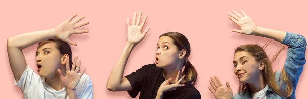 Shocked Faces Young Gils Looking Glass Isolated Pink Background Models — Stock Photo, Image