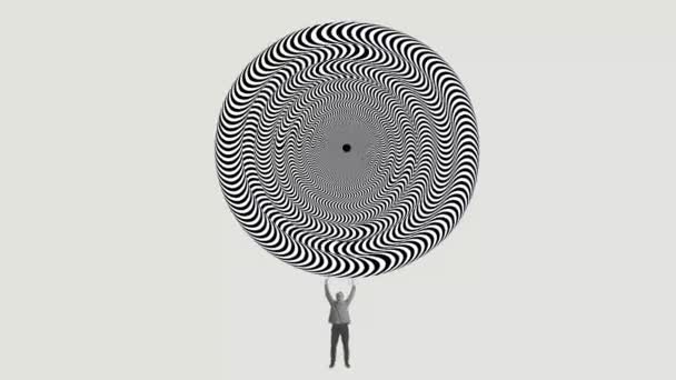 Maličký Muž Zvedající Obrovský Kruh Vzorem Optické Iluze Nad Hlavou — Stock video