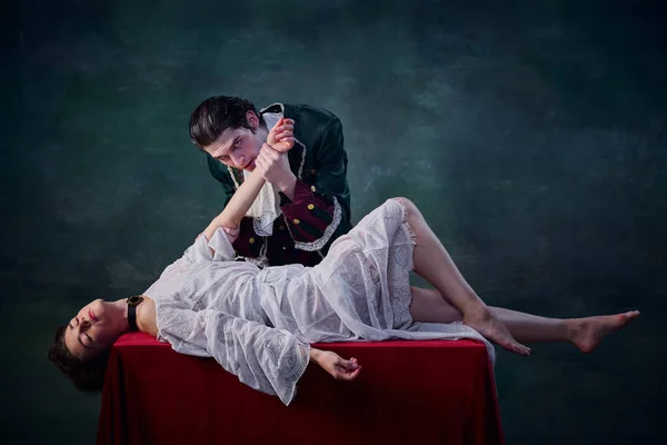 Portrait Man Image Vampire Biting Hand Young Woman Lying Table — Stock Photo, Image