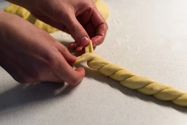 Female Hands Braiding Dough White Kitchen Table Close — стоковое фото