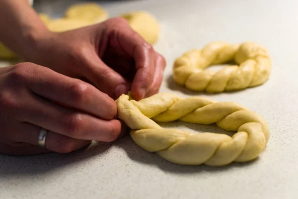 Close Female Hands Braiding Dough — стоковое фото