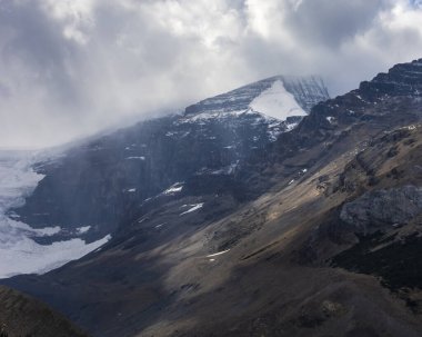 Stunning sun rays shining on the peaks and glaciers at Columbia Ice field, Alberta, Canada.
