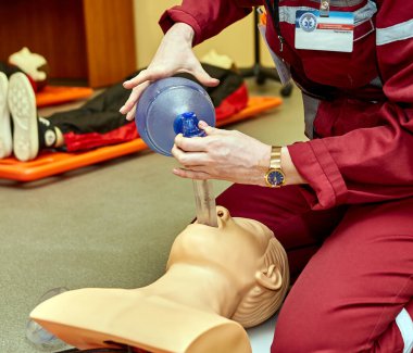CPR first aid resuscitation adult man life size training dummy model, doll face closeup, detail, mannequin mouth wide open, medical equipment. Paramedic class training simple props abstract concept clipart