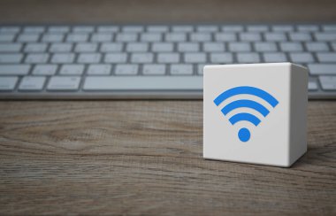Wi-fi düz simge beyaz blok küp üzerinde modern bilgisayar klavyesi ahşap masa üzerinde, teknoloji internet iletişim konsepti