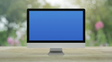 Law flat icon on desktop modern computer monitor screen on wooden table over blur pink flower and tree in park, Business legal service online concept