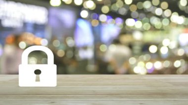 Padlock flat icon on wooden table over blur light and shadow of shopping mall, Technology internet security and safety online concept