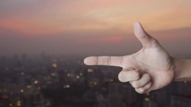 Open 24 hours flat icon on finger over blur of cityscape on warm light sundown, Business full time service concept