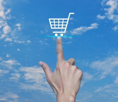 Hand pressing shop cart flat icon over blue sky with white clouds, Business shopping online concept