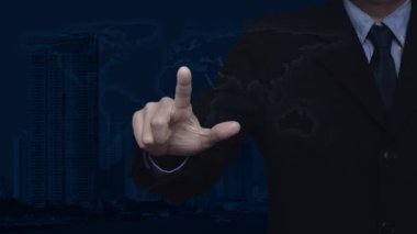 Businessman pressing free delivery truck flat icon over world map, modern city tower and skyscraper, Business transportation service concept, Elements of this image furnished by NASA