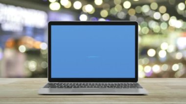 Law flat icon on modern laptop computer monitor screen on wooden table over blur light and shadow of shopping mall, Business legal service online concept