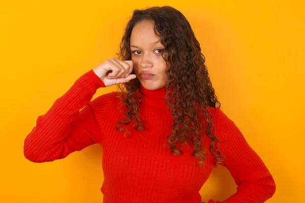 Unhappy Woman Wearing Red Sweater Standing Yellow Background Crying While — Stock Photo, Image