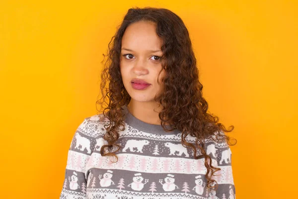 Portrait Dissatisfied Woman Wearing Christmas Sweater Agaist Yellow Studio Background — Stock Photo, Image