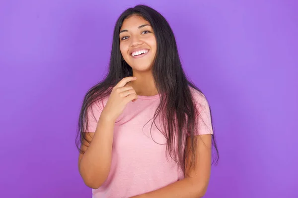 Optimistic Hispanic Brunette Girl Wearing Pink Shirt Purple Background Keeps — Stock Photo, Image